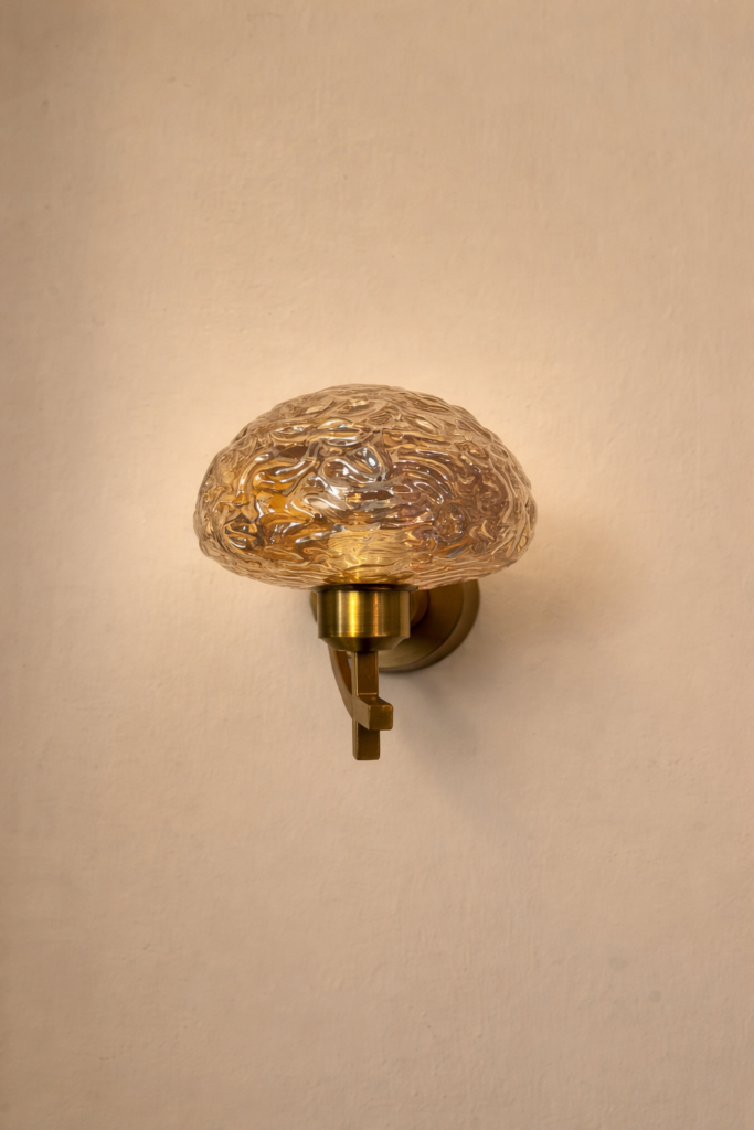 Dazzling gold finish wall light with amber glass by glitteron lights