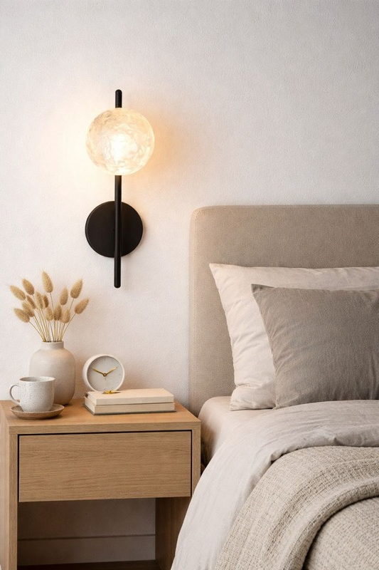 Black minimalist globe wall lamp for soft illumination